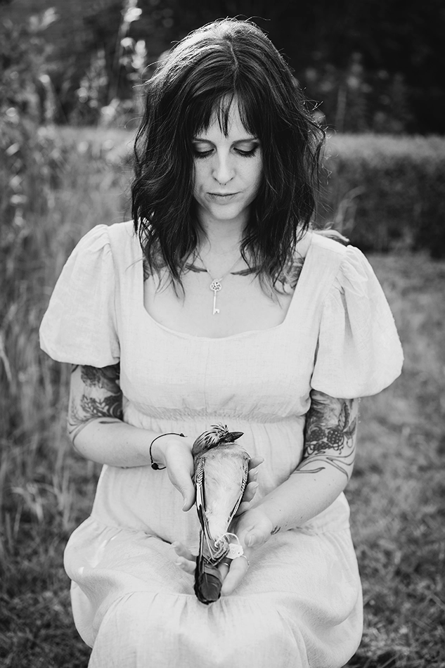 Krysten Newby Ethical Taxidermist Portrait of artist KRYSTEN NEWBY holding a dead bird ready for the ethical taxidermy process